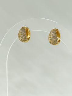 The Radiant Stone Huggies are an update to our classic style, with a teardrop design adding a few extra rows of shine. Paired with the Classic Stone Huggies, this is our favorite earring stack. 18K gold plating on 925 sterling silver Cubic zirconia Water resistant, hypoallergenic Luxury Hammered Huggie Earrings, Gold Teardrop Diamond Hoop Earrings, Gold Teardrop Jewelry With Pave Setting, Gold Teardrop Pave Set Jewelry, Gold Teardrop Pave Jewelry, Classic Gold Huggie Earrings With Sparkling Stones, Gold Huggie Earrings With Pave Setting For Wedding, Gold Diamond Teardrop Hoop Earrings, Classic Gold Teardrop Earrings With Diamond Accents