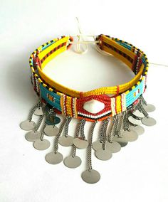 These are 100% handcrafted using fine beads, beading wire and chains. In this listing; You get 2 beaded maasai chokers(all adjustable) for USD.20 You can wear them as single necklaces or both of them. More neckleces here; https://www.etsy.com/shop/TribalTess?ref=seller-platform-mcnav&section_id=21306083 Back to my shop; https://www.etsy.com/shop/TribalTess?ref=seller-platform-mcnav Bohemian Silver Beads Choker For Festival, Bohemian Silver Beaded Choker For Festivals, Handmade Round Beads Choker For Festivals, Festival Choker With Silver Beads, Handmade Choker With Round Beads For Festivals, Adjustable Bohemian Choker, Large Beads Festival Choker, Festival Large Beads Choker, Handmade Beaded Choker For Festivals