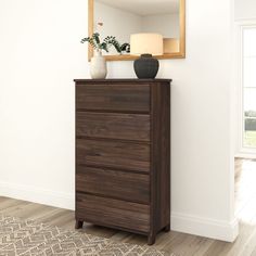 a wooden dresser sitting in front of a mirror on top of a hard wood floor