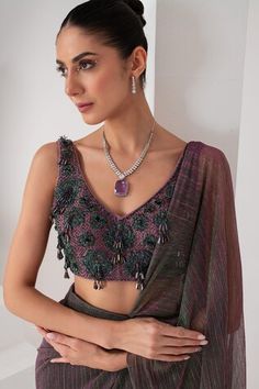 Purple metallic toned pre-draped saree crafted in platinoir crepe. Paired with a sleeveless V neck blouse with tonal crystal tassel and cutdana embellishments. - Aza Fashions Sleeveless Pre-draped Saree For Diwali, Fusion Style Unstitched Blouse Piece For Festive Occasions, Sleeveless Blouse With Zari Work For Evening, Sleeveless Choli For Evening And Diwali, Lavender Saree, Draped Saree, Crepe Saree, Purple Metallic, Drape Saree