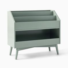 a grey wooden shelf with two shelves on one side and three drawers on the other