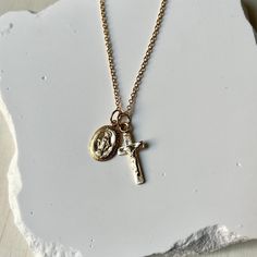 Introducing 'Lydia', our stunning Crucifix and Miraculous Medal charm necklace, a harmonious blend of faith and elegance. Beautifully crafted, this necklace is available in 14k gold-filled or 925 sterling silver, offering timeless sophistication.  * 16" and 18"  * 14K Gold Filled or 925 Sterling Silver * Water and Tarnish Resistant * Spring Clasp Spiritual Necklace With Delicate Cross Pendant Chain, Spiritual Cross Pendant Necklace With Delicate Chain, Spiritual Cross Charm Necklace With Adjustable Chain, Spiritual Charm Necklace With Cross Pendant And Adjustable Chain, Personalized Spiritual Crucifix Necklace, Spiritual Nickel-free Cross Pendant Necklace, Spiritual Crucifix Charm Necklace, Cross Charm Necklaces For Gifts, Cross Shaped Charm Necklace For Gifts