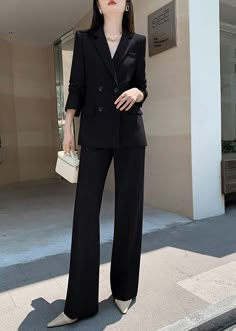 Elevate your wardrobe with our Estelle Double Breasted Blazer Wide Pants Suit. This two-piece set features a sophisticated and exclusive design with a double-breasted blazer and wide-leg pants. Perfect for any occasion, this black suit exudes elegance and taste. Blazer: Double Breasted closure Notched lapels Long sleeves Front flap pockets Pants Zip fly with button closure Side slant pockets Regular length - Polyester, spandex- Item #431910- Women's blazer & pants suit two-piece set SIZE INFO XS Suit Fits Women, Cute Black Suits For Women, Feminine Suits Wedding, Women's Pant Suit, Womens Suits Black, Women In Black Suits, Women In Blazer, Women In Pant Suits, Blazer And Pants Set Women