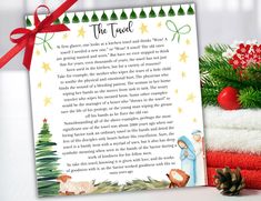 a christmas letter to santa claus and other holiday items with a red bow on top