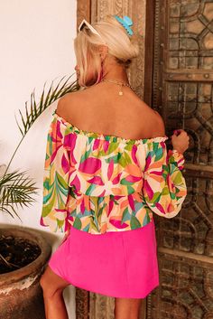 - Bring out your flirty side with this beautiful chiffon top - Wide, elastic neckline with ruffle detail - Lightweight, chiffon material with a colorful design - Lined bodice - Long, loose sleeves with smocked cuffs - Elastic waistline - Flowy, yet figure flattering silhouette that falls into a ruffled hemline Loose Sleeves, Chiffon Material, Colorful Design, Chiffon Top, Chiffon Tops, Color Design, Bodice, Chiffon, Elastic