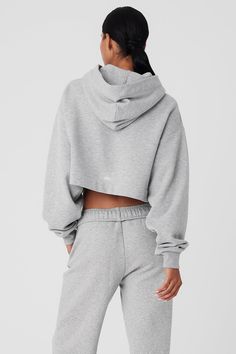 A cute and comfy counterpart to your high-waisted favorites, the Bae Hoodie has a relaxed fit, long scrunchable sleeves, ribbed cuffs and a slightly cropped ribbed hem that highlights the natural waist. The pocketless design is streamlined and bulk-free, and the French terry is an absolute pleasure to pull on: smooth on outside and fleecy on the inside. Fall Cropped Hooded Sweater In Athleisure Style, Fall Stretch Hoodie With Ribbed Waistband, Ribbed Athleisure Hoodie For Fall, Alo Yoga Casual Hoodie For Loungewear, Fall Ribbed Hoodie Athleisure Style, Casual Alo Yoga Hoodie For Loungewear, Alo Yoga Cropped Tops For Fall, Sporty Hoodie With Ribbed Collar For Loungewear, Comfortable Hoodie With Ribbed Cuffs And Stretch