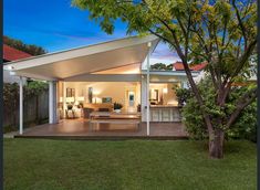 an outdoor living area with a covered patio