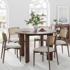 a dining room table with chairs around it