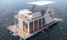 a houseboat floating on top of the water with an awning over it's roof