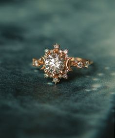 a diamond ring sitting on top of a table