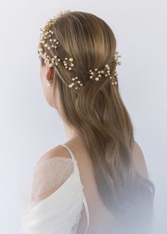 The Primavera Hair Pins were inspired by the ethereal essence of a Botticelli painting. Each pin in this set of three is comprised of numerous Swarovski pearls, which are meticulously strung by hand in our Brooklyn studio, creating a diaphanous spray of pearls with the illusion they're floating in midair. Consider pairing with the matching Primavera Circlet, or mixing with the Perla Bobby Pins. Packaging Dimensions: 6.5 x 6.5 x 1.75 inches Weight: Hair Pin Bride, Pins Packaging, Bridal Hairpins, Ethereal Essence, Bohemian Wedding Hair, Bride Hair Pins, Luxury Hair Accessories, Wedding Hairstyles Bride, Gold Hair Accessories