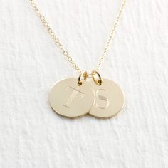 "Gorgeous double solid gold initial necklace... the perfect gift! PICTURE IS ENLARGED TO SHOW DETAIL! PLEASE READ BELOW FOR ACTUAL MEASUREMENTS!! Two solid gold 1/2\" discs have been personalized just for you with my 7mm typewriter font. The pendants are engraved with your choice of letters (entire alphabet in typewriter font shown in second picture) They hang from a solid 14k gold 1.5mm cable chain in either 16, 18, or 20\" in length. PLEASE REMEMBER PICTURES ARE TAKEN CLOSE UP TO SHOW DETAIL. Classic Necklaces With Initials On Round Pendant, Classic Round Pendant Necklace With Initials, Classic Necklaces With Initial Pendant For Anniversary, Classic Necklaces For Anniversary With Initial Pendant, Classic Initials Necklace As Personalized Gift, Classic Gold Charm Necklaces With Polished Finish, Classic Round Disc Jewelry With Initials, Classic Tan Necklace With Initials, Classic Initial Pendant Charm Necklace For Anniversary