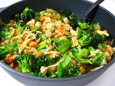 a bowl filled with broccoli and carrots