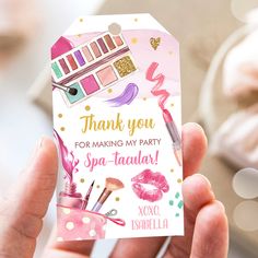 a person holding up a thank card with makeup items on it and the words, thank you for making my party spa - tacular