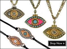 four necklaces with different colors and designs on them, one has an evil eye