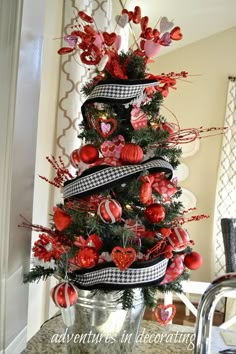 a christmas tree decorated with red and black ornaments