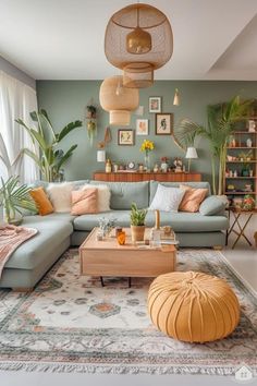 a living room filled with lots of furniture and plants on the wall above it's coffee table