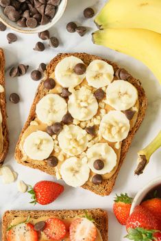 two pieces of bread with bananas and strawberries on it next to some chocolate chips