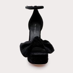 Refine your style with the Benton by Dee Ocleppo. These exquisite heels combine a plush velvet texture with a commanding platform and chic ankle strap for a secure and stylish fit. Ideal for special occasions, the dramatic color and elegant bow embellishment make these shoes a standout addition to any wardrobe. - Heel Height: 3-1/2 inches - Fit: True to size - Chic ankle strap with clasp - Velvet bow embellishment Luxury Heels With Bow And Round Toe, Elegant Velvet Party Heels, Velvet High Heel Party Shoes, Party Velvet High Heel Shoes, Chic Platform Heels For Evening, Chic High Heels With Detachable Bow, Chic Evening Platform Heels, Velvet Evening Heels, Velvet Heels For Evening