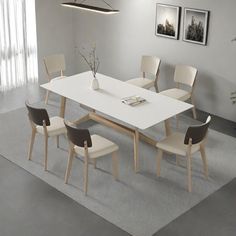 a white table and chairs in a room