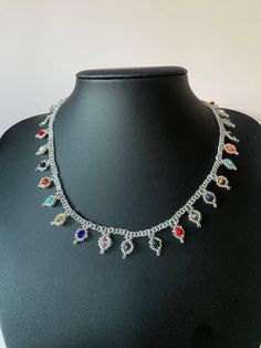 Discover the beauty of a truly unique accessory with our handmade crystal bead necklace. This stylish choker features vibrant, colorful crystal beads and is meticulously crafted with care to ensure high quality and a perfect fit. Ideal as a chic gift for women who appreciate artisanal jewelry, this necklace adds a touch of elegance to any outfit. Key Features: Handmade: Each necklace is individually crafted with attention to detail. Crystal Beads: Bright and colorful crystals that catch the ligh Bohemian Multicolor Crystal Jewelry, Crystal Jewelry With Tiny Beads For Gifts, Crystal Jewelry With Tiny Beads As Gift, Multicolor Crystal Choker Jewelry, Silver Beaded Crystal Choker Necklace, Bohemian Multicolor Crystal Beaded Necklaces, Crystal Beaded Necklaces For Gifts, Multicolor Crystal Necklaces For Jewelry Making, Crystal Beaded Chain Necklaces For Gift