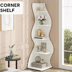 the corner shelf is white and has flowers on it in front of a window with pink walls