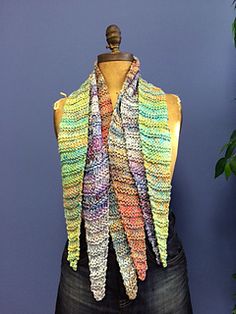 a mannequin wearing a multicolored scarf