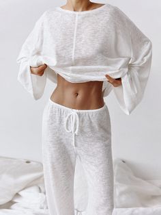 Elevate your relaxation game with our Round Neckline Long Sleeve Pajama Set. This sleek and breathable ensemble in classic white features long sleeves and long pants, perfect for leisurely evenings at home. Its understated elegance and semi-sheer fabric add a touch of allure to your loungewear collection.Key Features:Comfortable Design: Crafted for comfort, this pajama set boasts a round neckline and long sleeves, providing a cozy fit for lounging.Stylish Simplicity: The minimalist design exudes Dirndl Outfit, Bandeau Tops, Sleepwear Sets, Home Wear, Pyjama Set, Sleeves Pattern, Sleepwear Women, Two Piece Outfit, Flared Sleeves