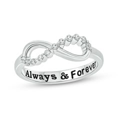 a silver ring with the words always and forever engraved on it's sides, set in