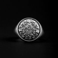 Introducing the Rococo Floral Signet Ring, a stunning piece of jewelry that is handmade with high quality 925 sterling silver. This beautiful ring features a delicate floral design that is perfect for any occasions. Whether you're attending a formal event or simply enjoying a night out with friends, this ring is sure to turn heads. The signet style is classic and timeless, while the Rococo-inspired floral design adds a touch of glamour and sophistication. With its high quality craftsmanship and eye-catching design, the Rococo Floral Signet Ring is a must-have addition to any jewelry collection. ➤ Item Details * Material: 925K Sterling Silver * Weight: 11-13 grams * Ring Diameter: 1.85 Cm ( 0.73 in) ➤ Shipping Details * Free shipping all over the world. * Processing time: 1-3 business days. Vintage Sterling Silver Signet Ring For Wedding, Elegant Ceremonial Ring With Engraving Option, Antique Silver Wedding Ring Jewelry, Elegant Round Engraved Ring With Engraving Option, Elegant Oval Engraved Flower Ring, Heirloom Etched Signet Ring For Wedding, Wedding Silver Signet Ring With Engraving Option, Elegant Sterling Silver Ceremonial Rings, Elegant Engraved Flower Ring For Formal Occasions