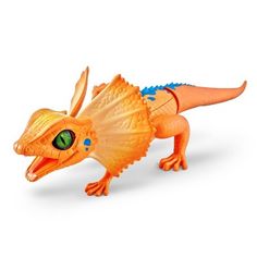 an orange toy lizard with green eyes on a white background