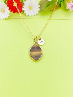 This is gold tone Natural Tiger Eye charm with hand stamped initial charm on brass/stainless steel 18 inches chain. ♥ You will receive 1 necklace. HOW TO ORDER 1) Select the quantity 2) Select the initial 3) Add to cart DESCRIPTION ♥ Necklace, Stainless Stee Chain with Lobster Claw Clasp, Size: about 17.7 inches (45cm) long, 1-2mm wide, Nickel Safe, *stainless steel is durable, highly resistant to rust and corrosion. ♥ Initial Charms, Gold Plated over Stainless steel, Size: about 8-10mm in diameter, 1mm thick, Nickel Safe, ♥ Natural Tiger Eye Pendants, Oval Charms with Golden Brass Edge, Size: about 13mm wide, 22mm long, 3~5.5mm thick ♥ Materials from the USA and international sourcing, Made and ship from Gowen, Michigan. GIFT READY: ♥ Invoice will be sent to you by email. We will not incl Everyday Personalized Brass Charm Necklaces, Everyday Personalized Brass Charm Necklace, Hand Stamped Brown Jewelry As A Gift, Hand Stamped Brown Jewelry Gift, Hand Stamped Brown Jewelry For Gifts, Jewelry Personalized, Jewelry Card, Natural Jade, Necklace Personalized