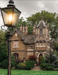 an old building with a lamp post in front of it