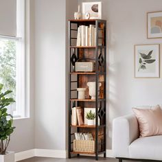 a living room filled with furniture and a book shelf in front of a white couch