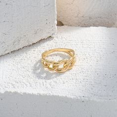 Make a bold statement with 14k real yellow gold Cuban Chain Statement Ring. This striking piece is perfect for those who seek for a conversation starter jewelry. Gold Chain Link Ring Made Of Metal, Gold Metal Chain Link Ring, Trendy Metal Chain Link Ring, Trendy Chain Rings In Metal, Trendy Metal Chain Rings, Elegant Metal Chain Ring, Modern Metal Chain Link Ring, Metal Chain Ring With Gold Link Chain, Metal Chain Ring With Link Shape