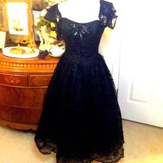 Stunning Vintage Dress. My Mannequin Was Too Big To Zip Up It Wasn’t Because Zipper Is Broke. Last Picture Shows Zipper Closed. Corseted With Boning In The Bodice. Just A Stunning Vintage Dress In Excellent Condition. No Size But I Think It’s A 4. Waist Laying Flat Is 13 Inches Bust Is Also 13 Inches. Price Is Firm. I Have Tons Of Vintage Clothes And Have Never Sold Any Of Them So This Is A First. Black Fitted Tea Length Dress, Black Tea-length Dress With Fitted Bodice, Black Lace Dress For Formal Occasions, Fitted Lace Vintage Dress For Evening, Elegant Black Vintage Dress For Party, Elegant Cocktail Dress With Attached Cancan, Elegant Black Vintage Party Dress, Vintage Ball Gown Dresses For Gala, Formal Fitted Evening Dress With Attached Cancan