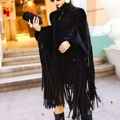 New Fringe Benefits Long Sleeve Turtleneck Poncho One Size - Fits Most Fits Size Sm To 2xl Material: Polyester Colors: Black Neckline: Turtle-Neck Closure: Front Zipper Decoration: Fringe Pattern: Solid Color Black Batwing Sleeve Poncho For Spring, Black Long Sleeve Poncho For Spring, Spring Long Sleeve Black Poncho, Chic Black Cape For Spring, Black Long Sleeve Evening Cape, Chic Black Cape Poncho, Chic Black Cape For Fall, Chic Black Fall Cape, Black Batwing Sleeve Cape For Fall