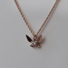 This delicate necklace is inspired by the fairy companions in the Legend of Zelda series. The pendant features a fairy with a glittering diamond body and solid gold wings. You can wear this beautiful necklace on all of your adventures, and I promise it won't be constantly yelling "hey!" or "listen!" CUSTOMIZE GEMSTONES ✶ solid 14 karat yellow, white, or rose gold✶ pendant measures 9.15mm wide x 6.8mm tall✶ 0.10 carat VS clarity, G-I color natural conflict-free diamondThis necklace will be handma Gold And Pearl Necklace, Zelda Ocarina Of Time, Trinity Ring, Winged Creatures, Ocarina Of Time, Rose Gold Chain, Necklace Diamond, Rose Gold Pendant, Cool Sunglasses