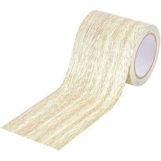 a roll of white tape on a white background