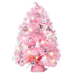 a pink christmas tree with white and silver ornaments