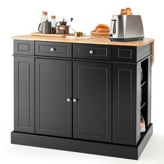 a black kitchen island with wooden top and drawers