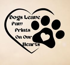 a heart shaped paw print with the words dogs leave paw prints on our hearts