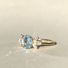 Pastel blue topaz accented with sparkle marquise cut earth mined diamonds makes this ring a breeze in the hot summer! *Stone info:   1pc of 8x6 oval cut sky blue topaz   6pcs of 4x2 marquise cut natural diamonds, G-H/SI quality *Topaz ct weight: approx. 1.6ct * Diamond ct weight: approx. 0.42ctw *Total ct weight: approx. 2.02ct. *Band thickness: 1.3mm * Metal: 14K Yellow Gold * Stamp: 14K ❤️Visit our official website for exclusive new products.      https://elekalonjewelry.com/ ❤️Follow us on In Diamond And Topaz Ring, Diamond And Blue Topaz Engagement Ring, Blue Topaz And Diamond Ring, Fine Jewelry Oval Blue Topaz Diamond Ring, Fine Jewelry Blue Topaz Diamond Ring, Light Blue Oval Diamond Topaz Ring, Blue Topaz Ring With Rose Cut Diamonds, Oval Aquamarine Diamond Ring Fine Jewelry, Oval Aquamarine Diamond Ring In Fine Jewelry Style