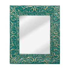 a green and gold framed mirror with an ornate design on the front, against a white background