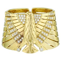 For Sale on 1stDibs - Absolutely stunning so special and unique this Egyptian Revival Horus Falcon Diamond Bracelet by Cartier is everything! Made in 18k Yellow Gold with round Cartier Diamond Bracelet Fine Jewelry For Formal Occasions, Cartier Diamond Accents Bracelet Jewelry, Formal Cartier Fine Jewelry Diamond Bracelet, Cartier Diamond Bracelet For Formal Occasions, Cartier Luxury Yellow Gold Diamond Bracelet, Cartier Diamond Bangle For Wedding, Cartier Gold Diamond Bracelets, Formal Cartier Diamond Bracelet, Cartier Diamond Bangle For Formal Occasions