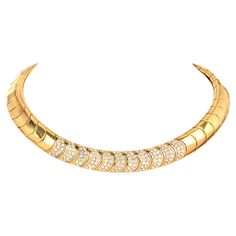 Presenting an Estate 18K Yellow Gold Diamond Collar Necklace  Crafted in Italian 18K Gold with natural round cut diamonds makes a perfect statement necklace. Articulated flexible Curved links around the collar necklace design help the necklace sit elegantly on the neck of the wearer.  Approximate Carat Total: 5.40 carats Color and Clarity Grade approx: VS1-VS2/G-H Secured With Insert Clasp with Safety Latch Metal Type: 18K Yellow Gold Total Item Weight approx: 104.4 Grams Width is approx: 13mm Luxury Yellow Gold Necklaces For Rituals, Luxury Yellow Gold Diamond Necklace For Party, Luxury Yellow Gold Necklace For Ceremonial Occasions, Luxury Gold Diamond Halo Necklace, Luxury Yellow Gold Necklaces, Luxury Gold Plated Diamond Necklace Tarnish Resistant, Luxury Traditional Yellow Gold Diamond Necklace, Luxury Yellow Gold Party Choker, Luxury Yellow Gold Diamond Custom Necklace