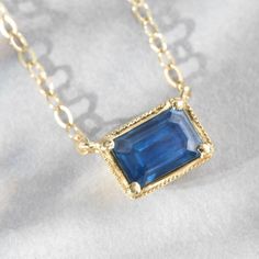 Our classic east west set emerald cut blue sapphire radiates a soothing blue shade for that perfect pop of color on your neckline. 14K sustainable gold 0.65ct emerald cut blue sapphire 16" chain with 15" option, lobster clasp closure Dimensions: 1/3" x 1/4"Delivery: Please allow up to 1-2 weeks for delivery. For rush orders please contact our Concierge. Sapphire Necklace Pendants, Appointment Book, Hues Of Blue, Sapphire Pendant, Fine Jewels, East West, Emerald Cut, Necklace Jewelry, Blue Sapphire