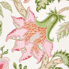 a pink and green floral print on white fabric, with leaves and flowers in the background