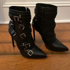 Brand New. Comes With Shoe Bag. No Damage Or Used. Has Some Price Stickers And Marks On The Underside Sold. Purchased From Neiman Marcus. Made In Italy. Leather Heels With Silver-tone Hardware And Pointed Toe, Black Boots With Metal Feet For Evening, Black Evening Boots With Metal Feet, Party Heels With Pointed Toe And Silver-tone Hardware, Edgy Heeled Boots With Buckle Closure For Evening, Black Pointed Toe Heels With Silver Studs, Black Heeled Boots With Buckle Closure For Party, Party Heels With Silver-tone Hardware, Silver-tone High Heel Party Heels