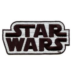 the star wars logo is shown in black and white on a dark brown background,